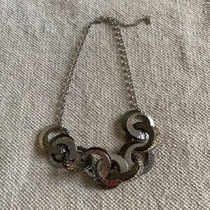 silver necklace with hammered, intertwined circular plates